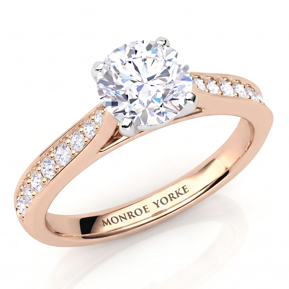 Denver rose gold engagement ring, round brilliant centre diamond and a tapered diamond set band.