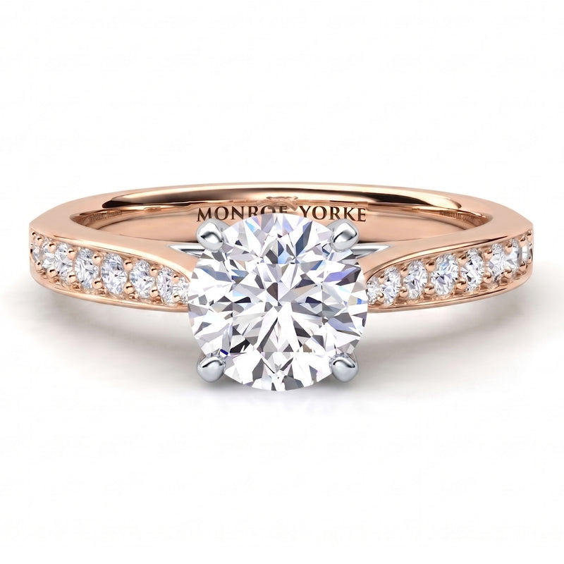 Denver rose gold engagement ring, round brilliant centre diamond in a four claw head with micro claw set diamonds on the band.