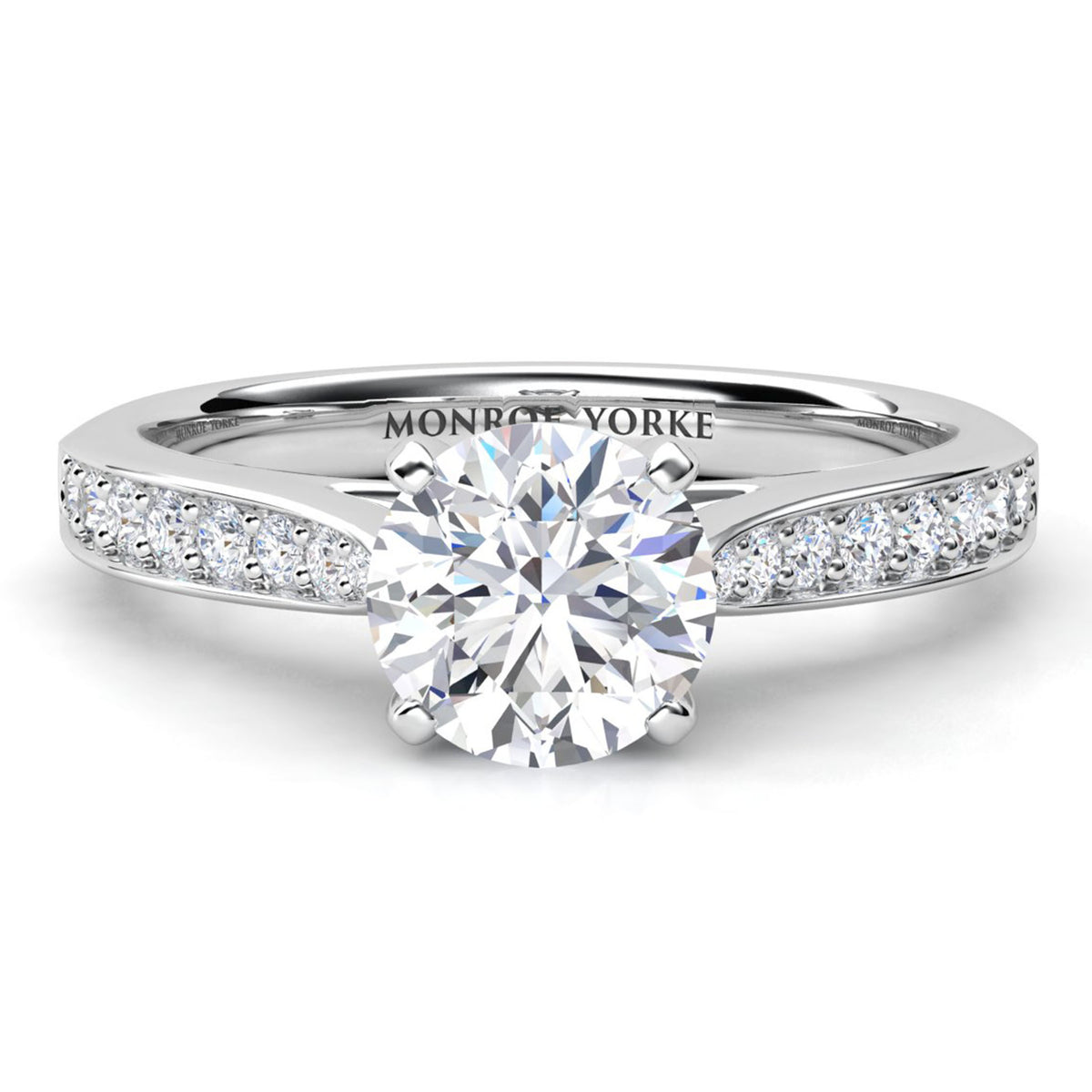 Denver engagement ring in white gold or platinum, round brilliant centre diamond in a four claw head, band tapering into the centre setting.