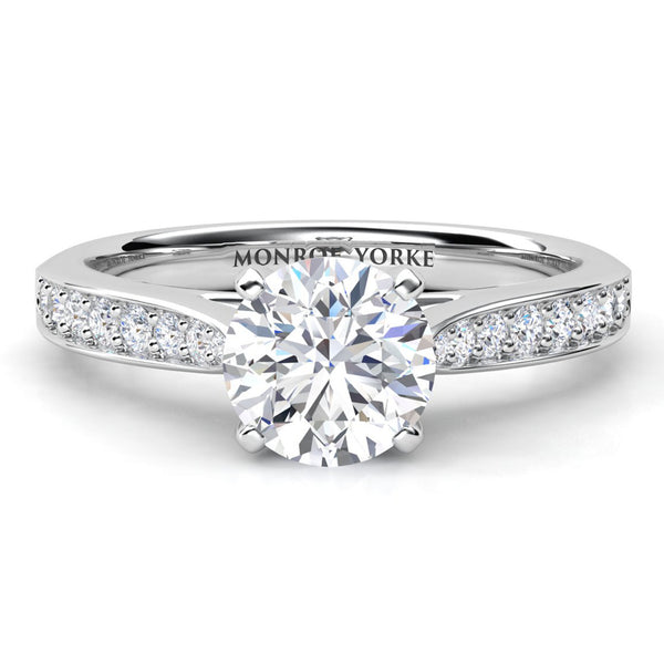 Denver engagement ring in white gold or platinum, round brilliant centre diamond in a four claw head, band tapering into the centre setting.
