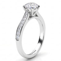 Denver engagement ring in white gold or platinum, side view of the diamond set band tapering into the four claw centre setting.