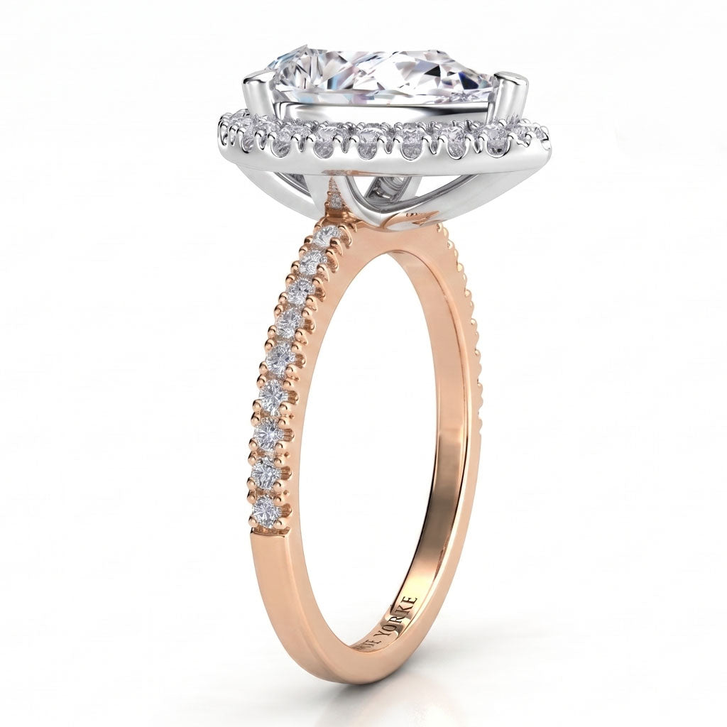 Dune in rose gold, close view of the pear cut centre and micro claw halo