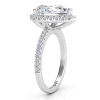 Dune pear cut diamond halo ring. Side view showing beautiful centre diamond halo setting and diamond set band.  18ct white gold  and platinum