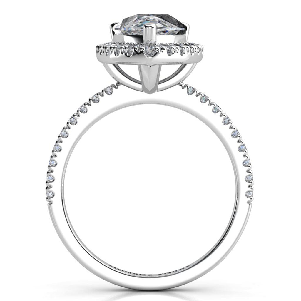 Dune pear cut diamond halo engagement ring in white gold, profile view of the diamond set band