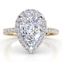 Dune in 18ct yellow gold, angled view showing the halo around the pear centre