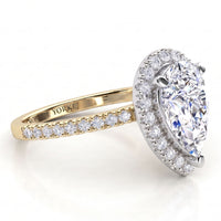 Dune in yellow gold, side view showing the halo setting and diamond set band