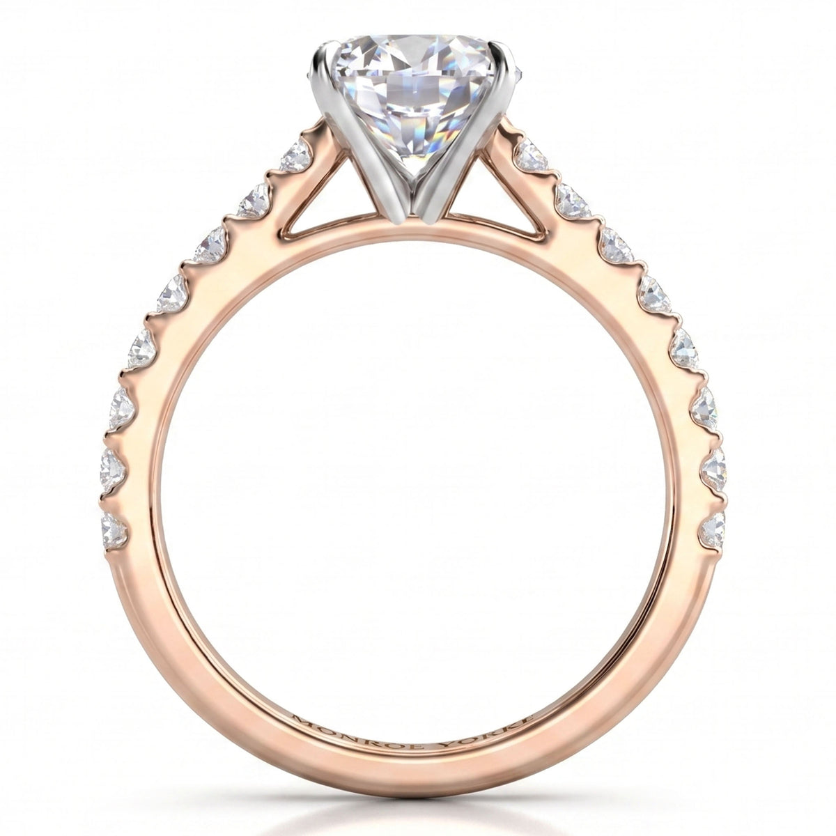 A rose gold diamond ring with a pear-cut center stone and pavé-set diamonds along the shoulders, shown on a clean white background.