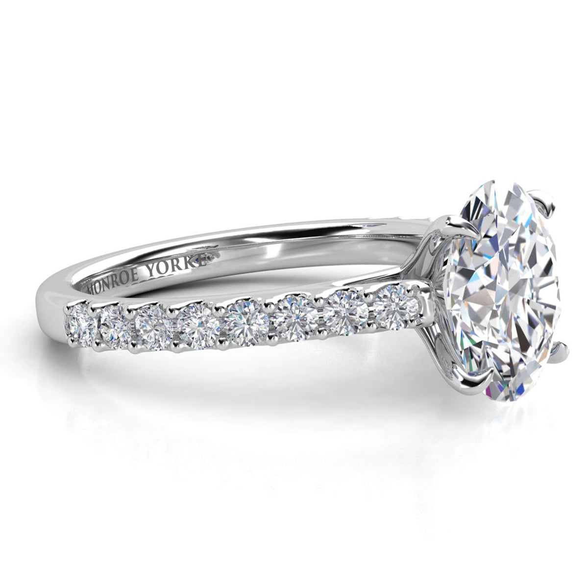 Side view of Elodie - oval shape diamond engagement ring in white gold or platinum