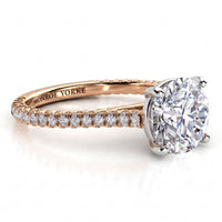 Elsie engagement ring in rose gold. Side view showing diamonds set to three sides of the band.