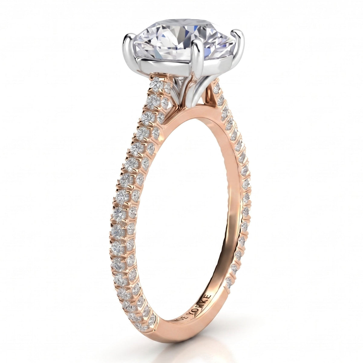 Elsie engagement ring in rose gold. Second side view of the open four claw centre setting.