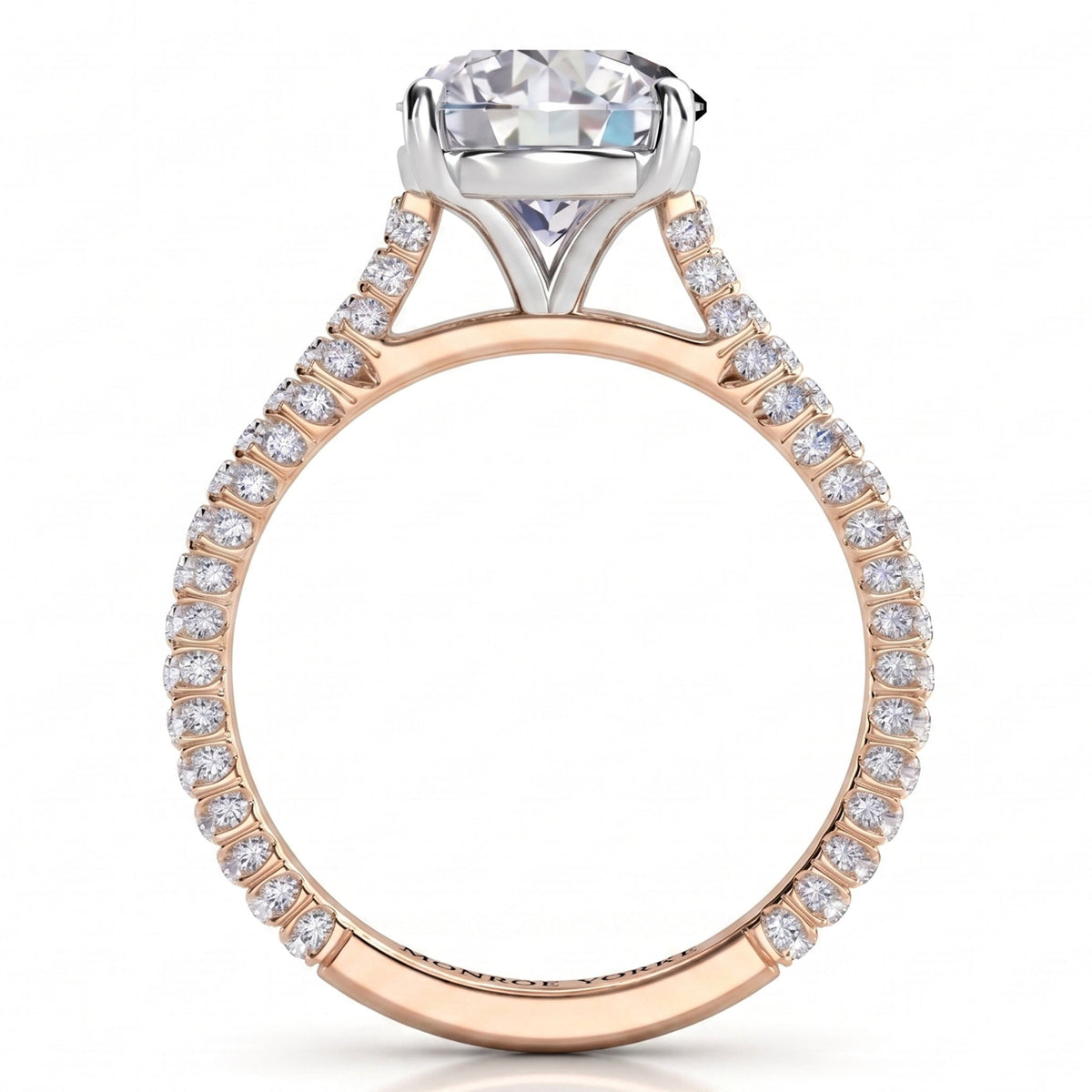 Elsie engagement ring in rose gold. Close view of the pave-set diamonds along the band.