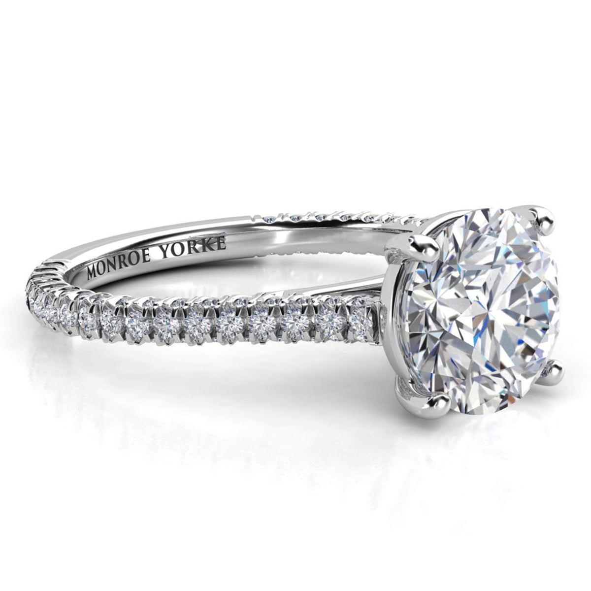 Elsie engagement ring in white gold or platinum. Side view showing diamonds set to three sides of the band.