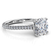 Elsie engagement ring in white gold or platinum. Side view showing diamonds set to three sides of the band.