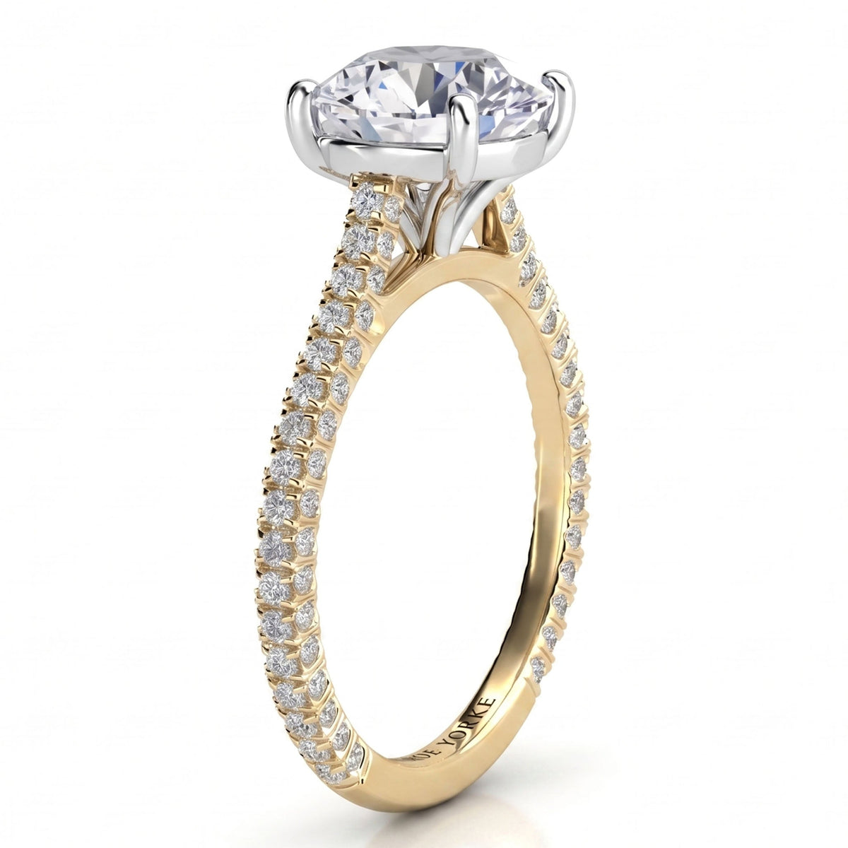 Elsie engagement ring in yellow gold. Second side view of the open four claw centre setting.