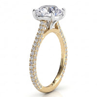 Elsie engagement ring in yellow gold. Second side view of the open four claw centre setting.