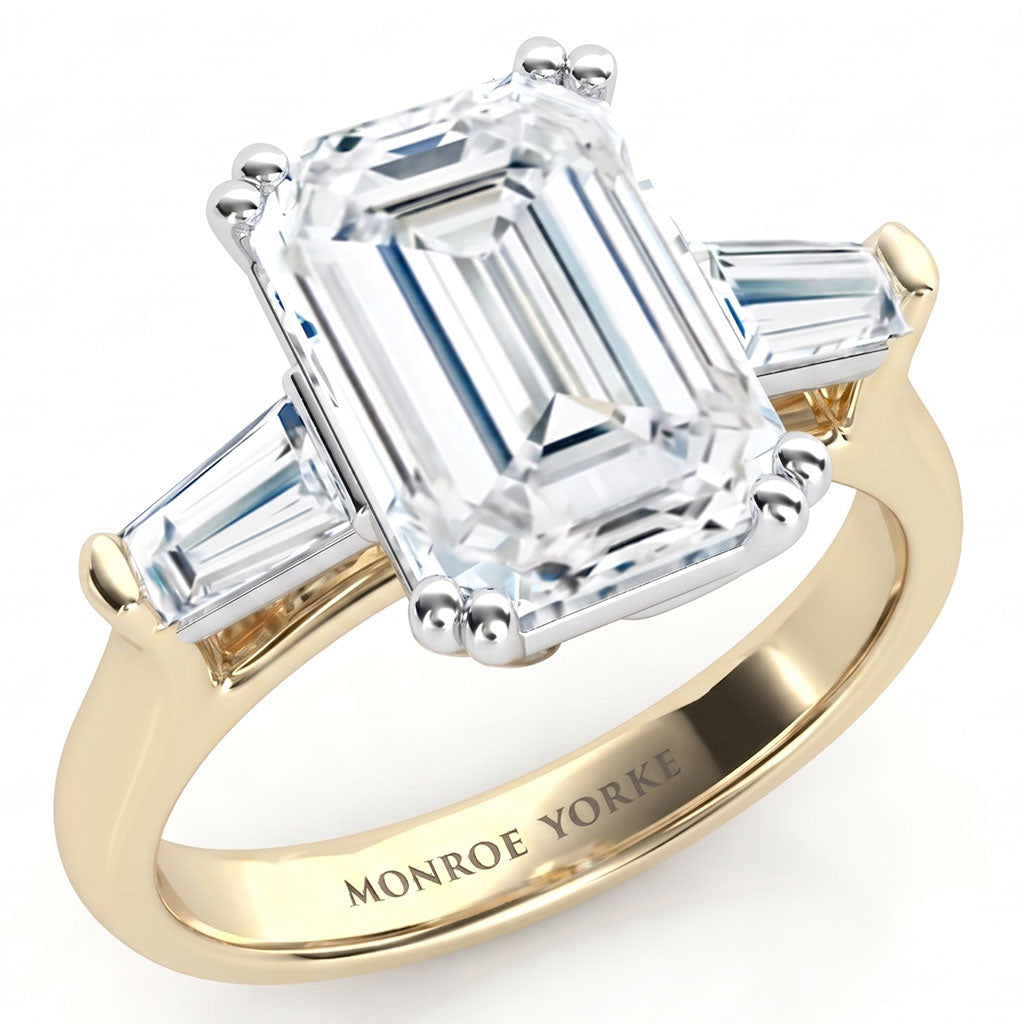 Envy emerald centre and tapered baguette  cut three diamond ring, Trilogy ring. yellow gold. 