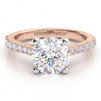 Enya rose gold engagement ring, round centre diamond with micro claw set diamonds along the shoulders, Monroe Yorke engraved on the band.