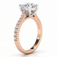 Enya rose gold engagement ring, round centre diamond and a row of micro claw set diamonds along the shoulder.