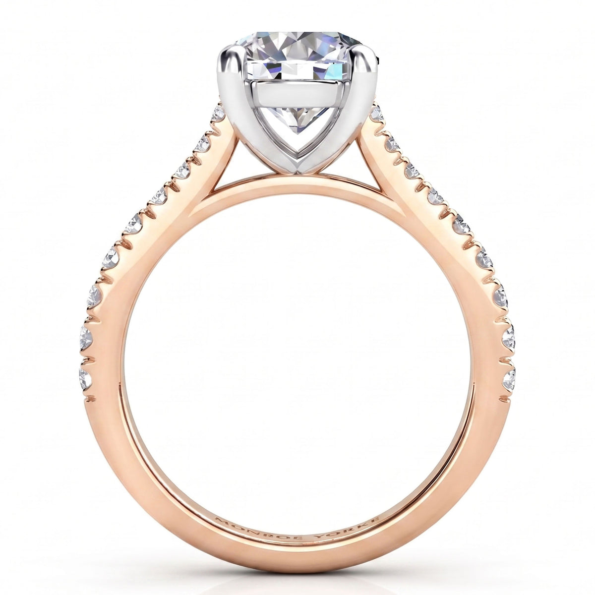Enya rose gold engagement ring, round centre diamond with micro claw set diamonds running along the shank.
