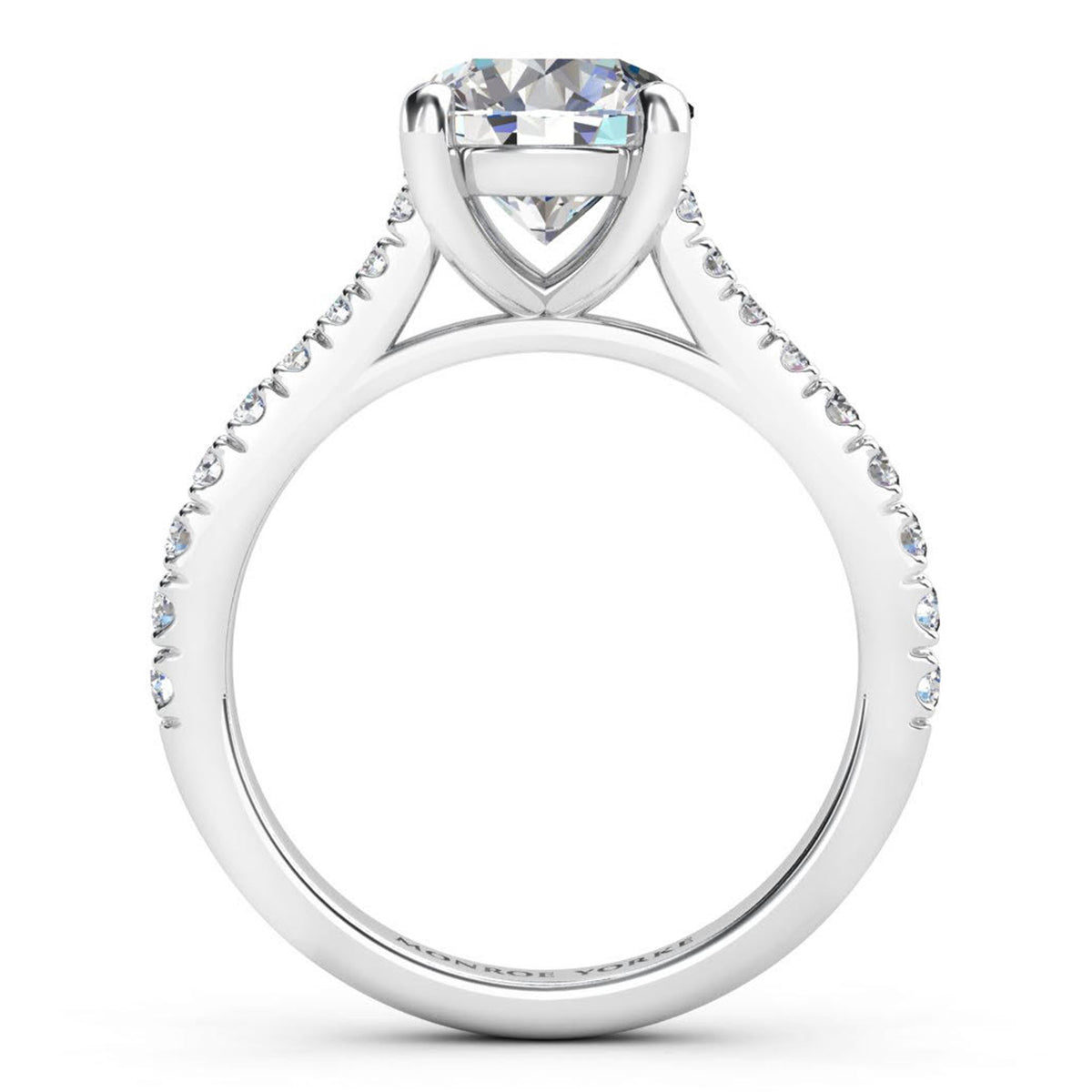 Enya engagement ring in white gold or platinum, round brilliant centre diamond above a micro claw set shank.