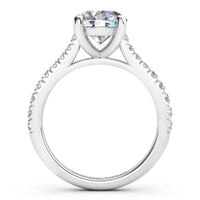 Enya engagement ring in white gold or platinum, round brilliant centre diamond above a micro claw set shank.
