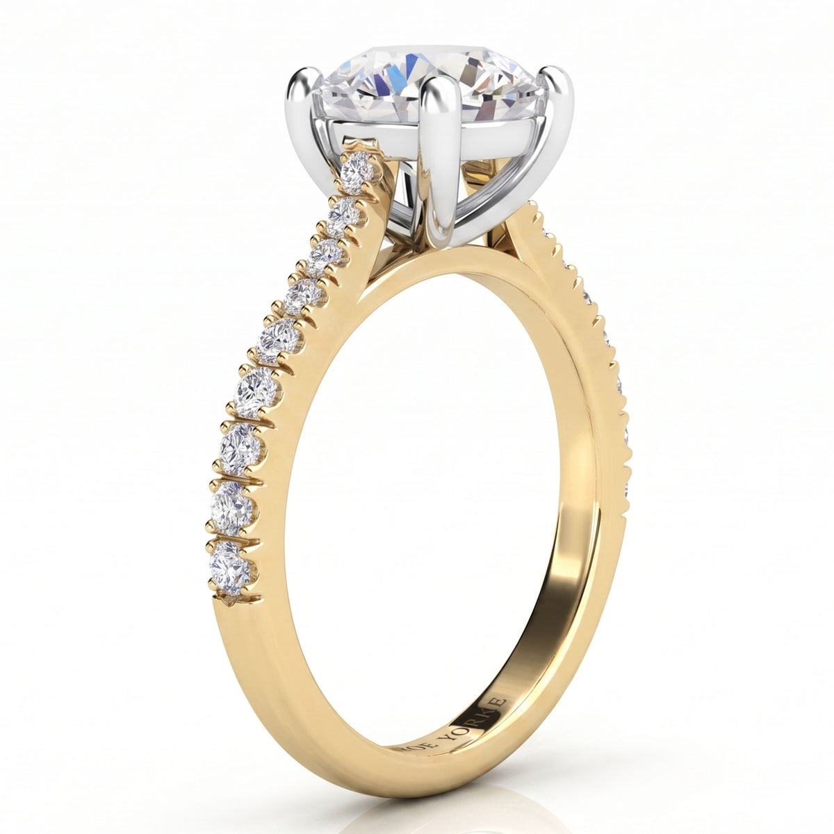 Enya yellow gold engagement ring, round centre diamond and a row of small round diamonds along the shank.