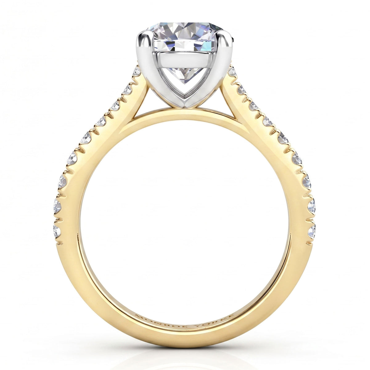 Enya yellow gold engagement ring, profile view of the four claw centre head and the sweep up band.