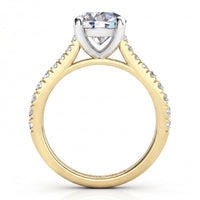 Enya yellow gold engagement ring, profile view of the four claw centre head and the sweep up band.