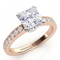 Fifth Avenue rose gold engagement ring, princess cut centre diamond with micro claw set diamonds on the band.