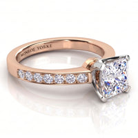 Fifth Avenue rose gold engagement ring, close view of the band set with small round diamonds.