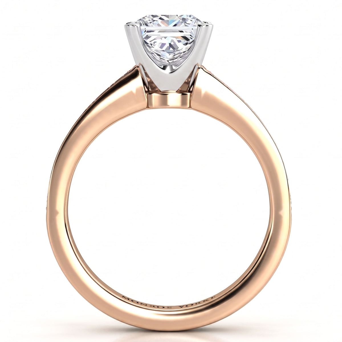 Fifth Avenue rose gold engagement ring, princess cut centre diamond held in a four claw head.