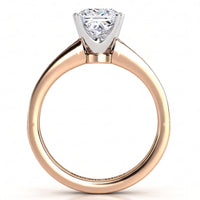 Fifth Avenue rose gold engagement ring, princess cut centre diamond held in a four claw head.