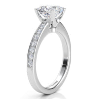Fifth Avenue engagement ring in white gold or platinum, side view of the princess cut centre diamond in its four claw head.