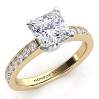 Fifth Avenue yellow gold engagement ring, princess cut centre diamond with micro claw set diamonds along the band, Monroe Yorke engraved inside the band.