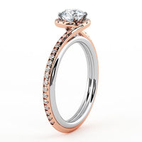 Gale two-tone halo engagement ring in rose gold, angled view of the pave shoulders and halo