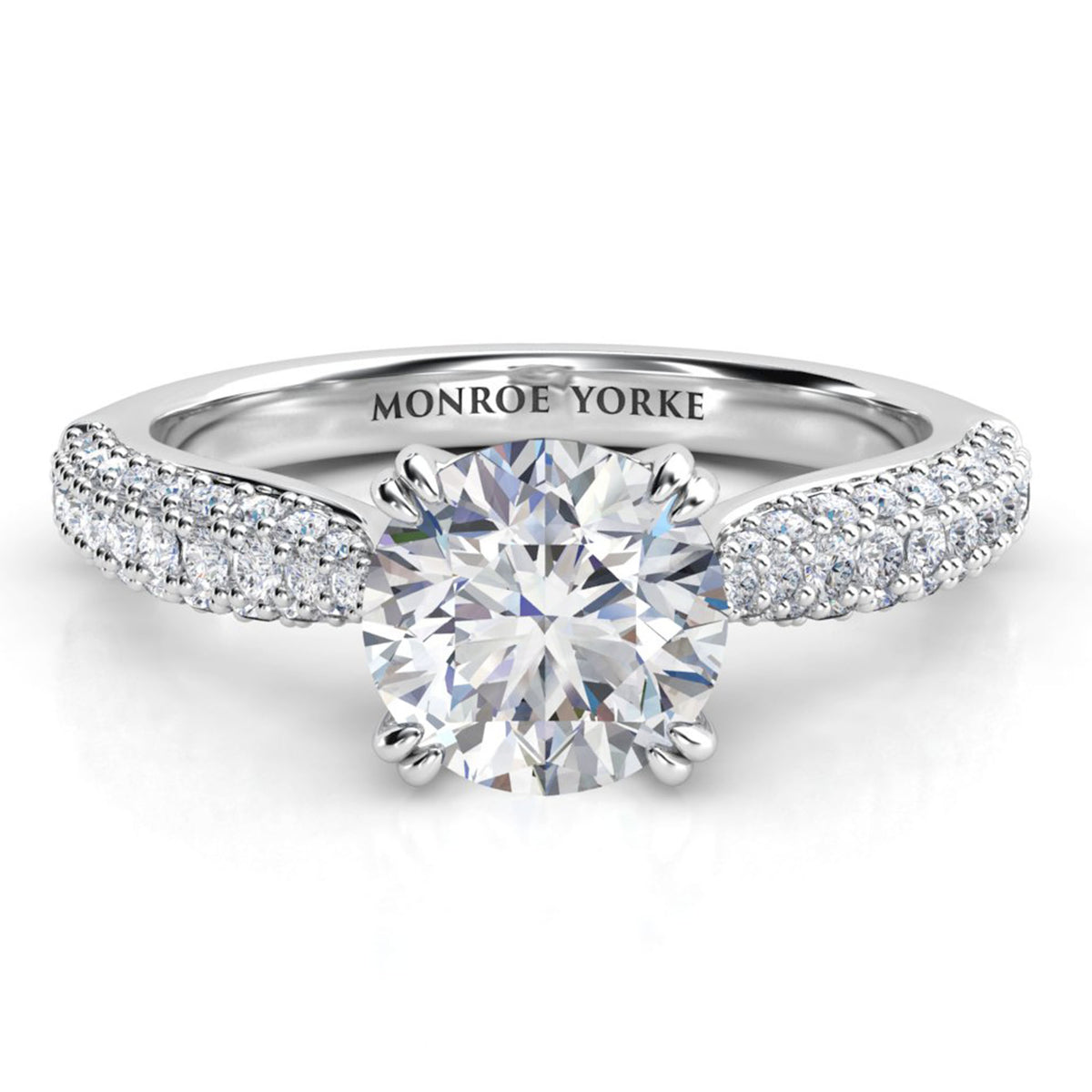 Harper - diamond engagement ring with a centre ound diamond in a double claw setting.  A curved band with 3 rows of pave set diamonds. white gold or platinum 