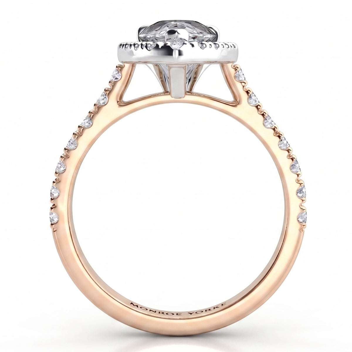 A rose gold engagement ring featuring a pear-cut clear centre stone in a halo setting, with small pavé-set clear stones along the shank.