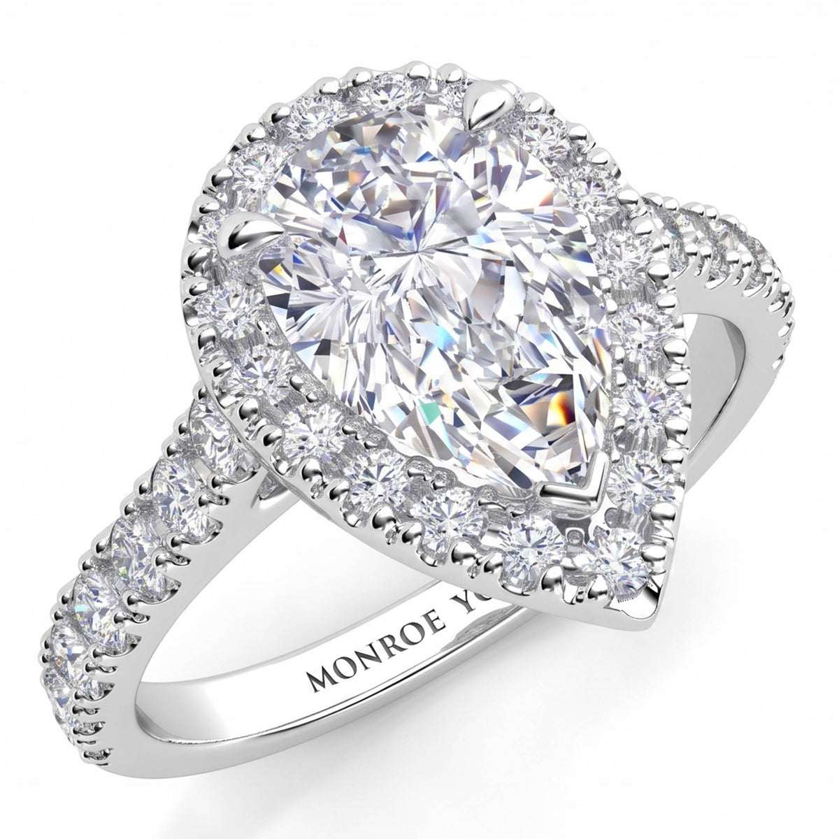 Iris - Platinum GIA certified pear cut diamond halo engagement ring with diamonds on the sweep up band. Also available in white gold