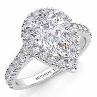 Iris - Platinum GIA certified pear cut diamond halo engagement ring with diamonds on the sweep up band. Also available in white gold