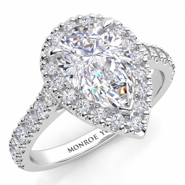 Iris - Platinum GIA certified pear cut diamond halo engagement ring with diamonds on the sweep up band. Also available in white gold