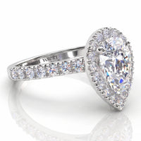 Iris - Platinum GIA certified pear cut diamond halo engagement ring.  Side view showing diamonds on the sweep up band. Also available in white gold