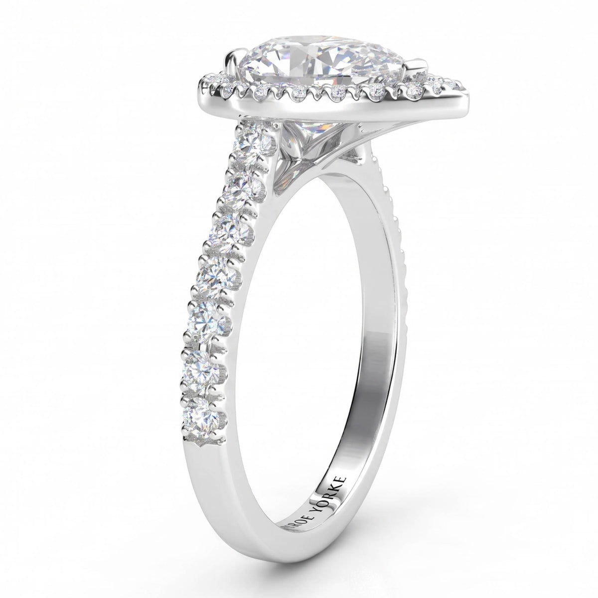 Iris - Platinum GIA certified pear cut diamond halo engagement ring.  Side view showing diamonds on the sweep up band. Also available in white gold