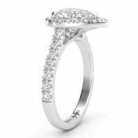 Iris - Platinum GIA certified pear cut diamond halo engagement ring.  Side view showing diamonds on the sweep up band. Also available in white gold
