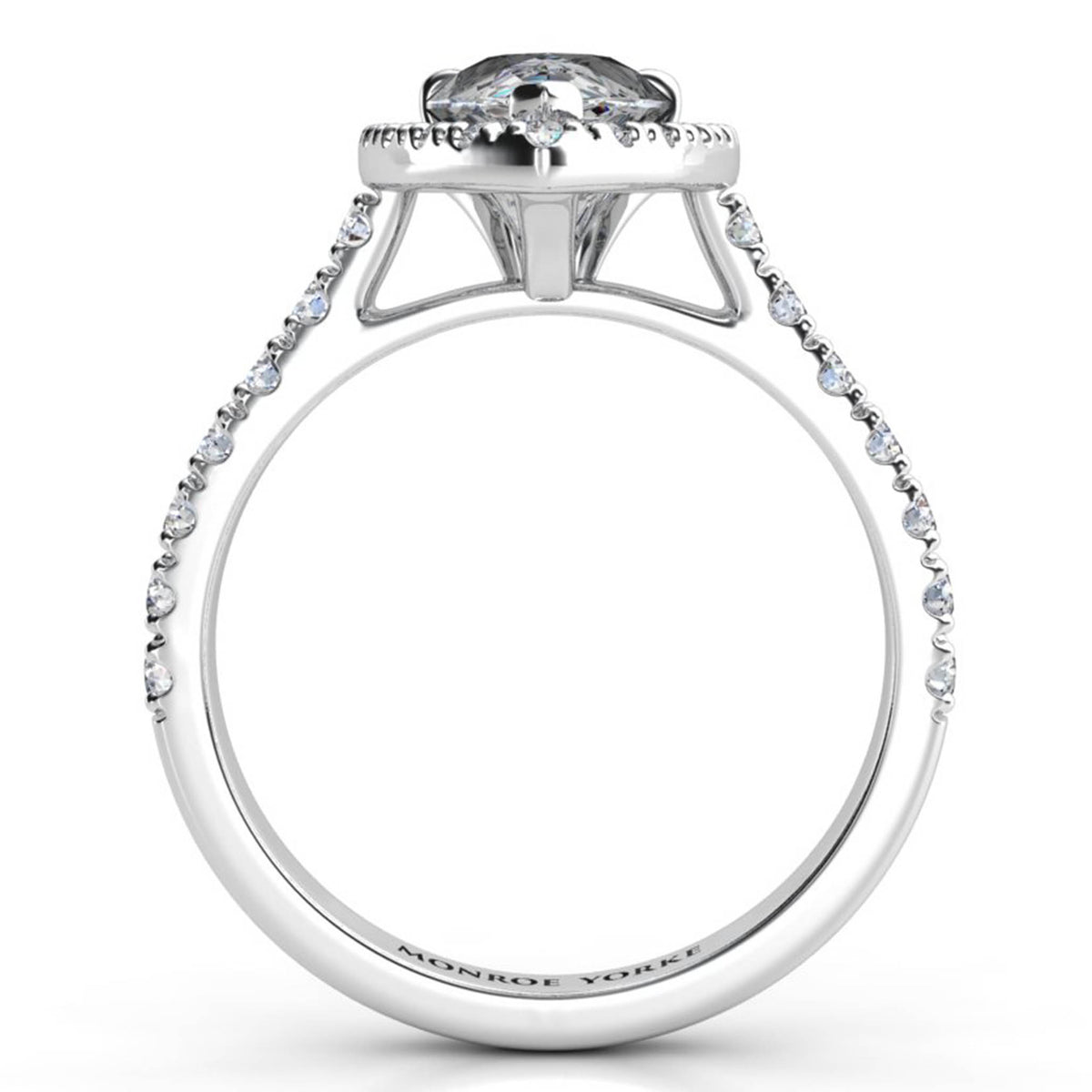 Iris - Platinum GIA certified pear cut diamond halo engagement ring.  Side view showing centre setting. Also available in white gold