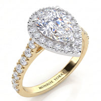 Iris - yellow gold GIA certified pear cut diamond halo engagement ring with diamonds on the sweep up band. 