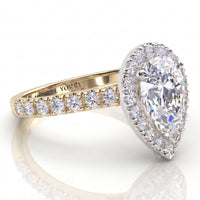Iris - yellow gold GIA certified pear cut diamond halo engagement ring.  Side view showing diamonds on the sweep up band. 