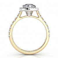A yellow gold engagement ring featuring a pear-cut clear centre stone in a halo setting, with small pavé-set clear stones along the shank. Side view