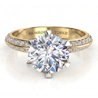 Juliet - a yellow gold engagement ring with a round brilliant-cut centre stone and two rows of pavé-set accent stones on the band, Knife edge band.  Centre 6 prong setting. 