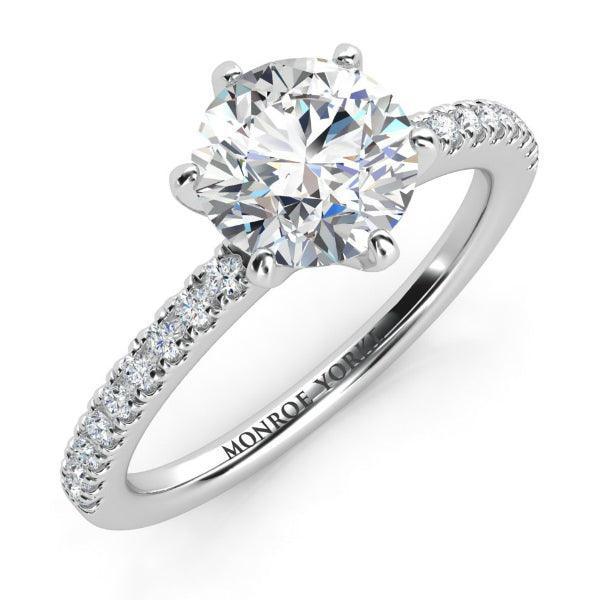 Lab grown diamond ring. Centre 1.50 carat round diamond. Pave set diamond band. 