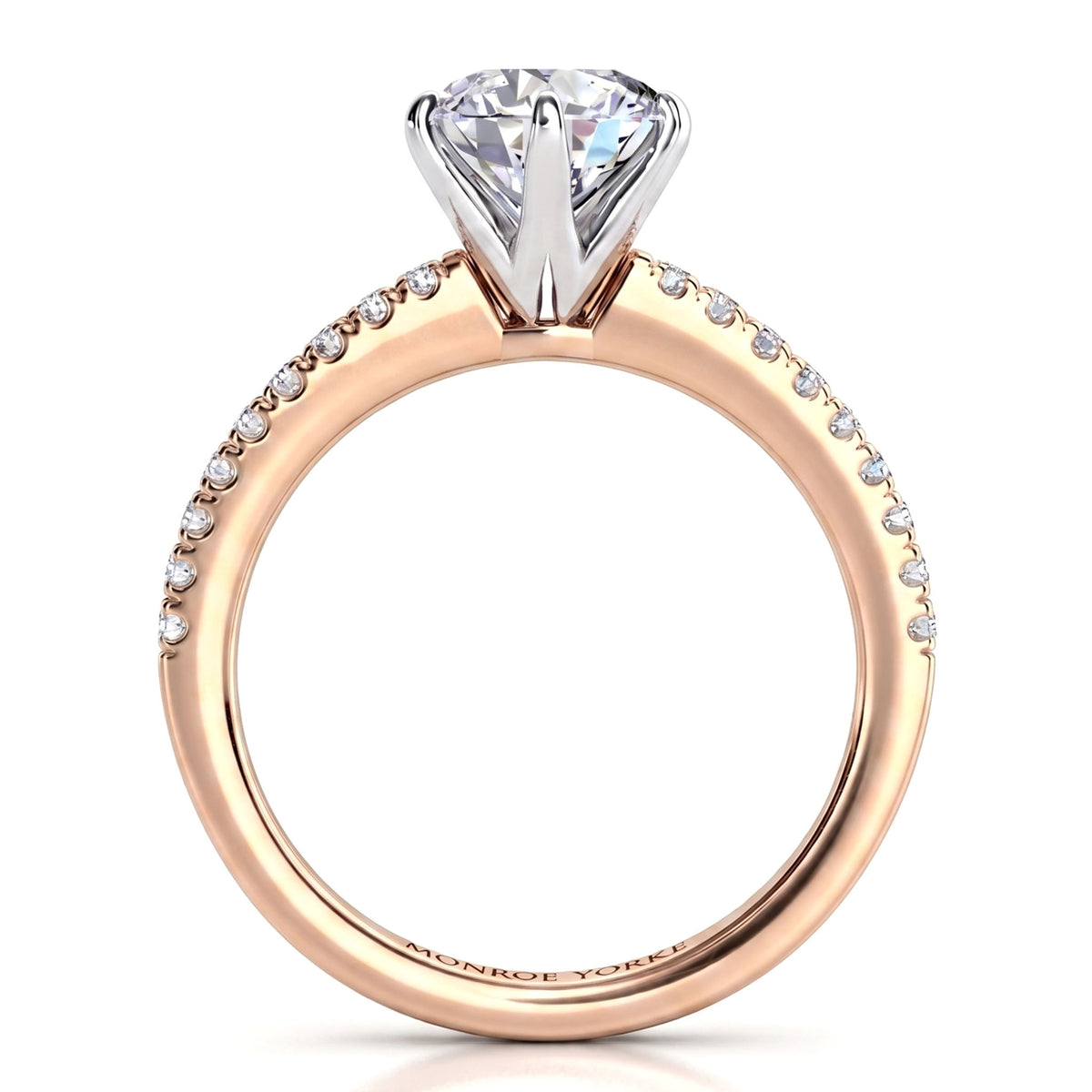 A rose gold diamond engagement ring with a large round-cut center stone and a pavé band set with small round diamonds, shown on a clean white background.